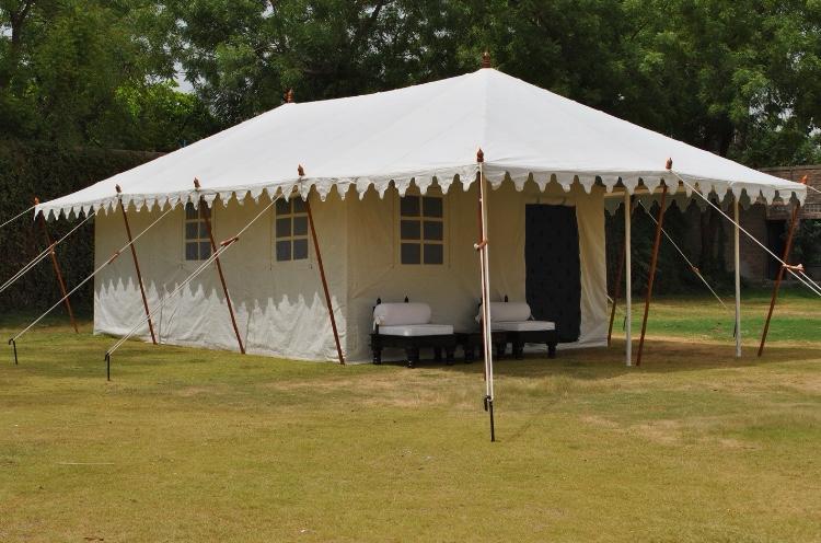 Applications Canvas tents pitched in a wooded outdoor campsite