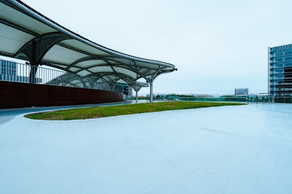 Shelters Fabric canopy shelter providing shade over an open lawn