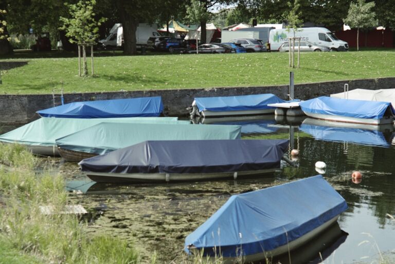 Moored boats under fitted canvas covers