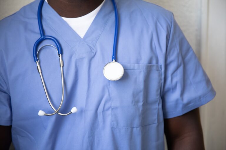 Healthcare worker in blue scrubs